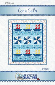 Windy Pinwheel blocks and Sailboats make the perfect child's nautical quilt. Or sample uses the Out to Sea collection by Northcott. Or, you use more realistic fabrics for the sailor in your life to make a nice wall hangin