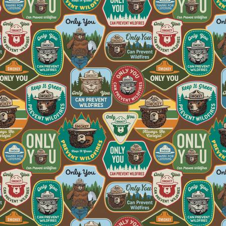 A collection of park signs featuring the iconic Smokey Bear cover a wood-brown background is the main fabric for this collection. Each bundle includes 6 fat quarters. Greens, browns, beige and black are main colors for this pack. From the Smokey the Bear Collection for Riley Blake. 100% Cotton, 44/5"