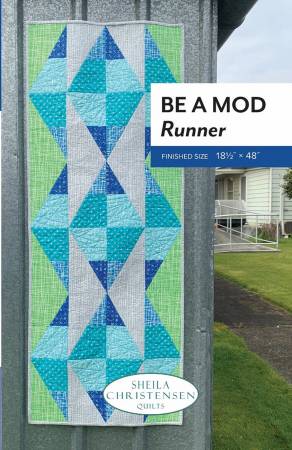 This runner has a fun mid-century modern look and is an easy project using the Half Sixty ruler by Sheila Christensen. Finished size 18 1/2" x 48"