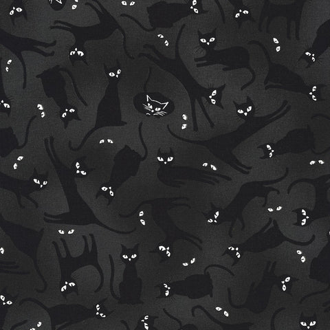 This fabric is covered in black cats on a black background with little cat eyes all over. This fabric glows in the dark. 